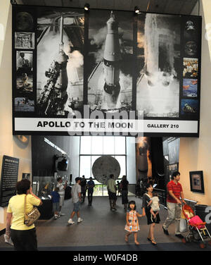 Tourists walk into the Smithsonian Air and Space Museum's 'Apollo to the Moon' exhibit on July 20, 2009 in Washington, DC.  Today is the 40th anniversary of astronaut Neil Armstrong's first walk on the moon via Apollo 11, on July 20, 1969.  The Apollo 11 crew was Armstrong, Buzz Aldrin and Michael Collins.   (UPI Photo/Pat Benic) Stock Photo