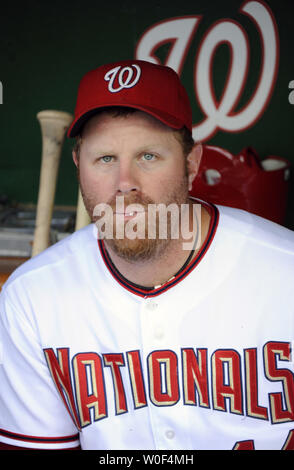 Adam Dunn, a free agent who has signed a $20 million, 2 year contract with  the Washington Nationals, wears his new uniform for the press, with his wife  Rachel and their son Brady, in Washington on February 12, 2009. (UPI  Photo/Alexis C. Glenn Stock