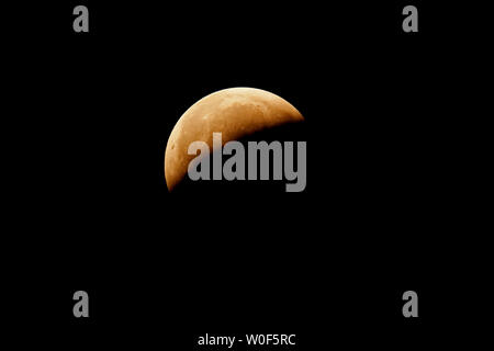 Seine et Marne. Total lunar eclipse of January 21, 2019. Partial phase after the totality. Stock Photo