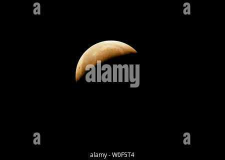 Seine et Marne. Total lunar eclipse of January 21, 2019. Partial phase after the totality. Stock Photo