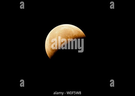 Seine et Marne. Total lunar eclipse of January 21, 2019. Partial phase after the totality. Stock Photo