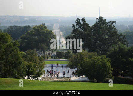 Visitors pass by the burial site of President John F. Kennedy and his family at Arlington National Cemetery in Arlington, Virginia on August 27, 2009.  Senator Kennedy, who passed away late Tuesday night at the age of 77, will be buried near his brother in Arlington.   UPI/Kevin Dietsch Stock Photo