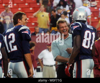 Minnesota Vikings wide receiver Randy Moss gives a hug to his former  teammate, New England Patriots quarterback Tom Brady at the end of the game  at Gillette Stadium in Foxboro, Massachusetts on