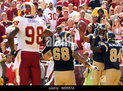 St. Louis Rams players (L to R) Samkon Gado, James Laurinaitis