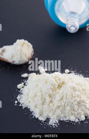 Baby milk powder, spoon and bottle Stock Photo