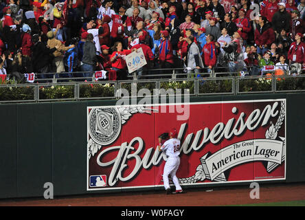 Philadelphia Phillies left fielder Raul Ibanez warms up at Coors