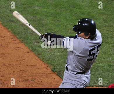 New York Yankees' Hideki Matsui, #55, is congratulated by team mates after  hitting a two-run homer off of the Philadelphia Phillies in which Alex  Rodriguez (L) scores in the second inning of