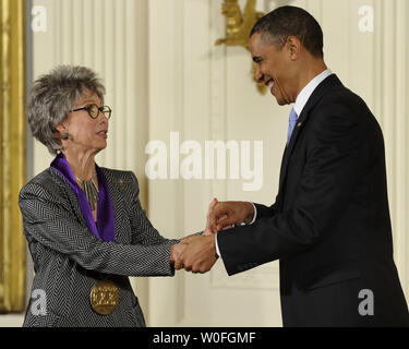 U.S. President Barack Obama shakes hands wih Rita Moreno after he awarded her the 2009 National Arts Medal during a ceremony in the East Room of the White House in Washington on February 25, 2010. Moreno, a Puerto Rican singer, dancer and actress, is the first and only Hispanic and one of ten performers who have won an Emmy, a Grammy, an Oscar, and a Tony.   UPI/Mike Theiler Stock Photo