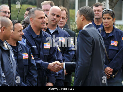 U.S. President Barack Obama greets members of FEMA, who assisted in Haiti following the countries devastating earthquake, following a meeting in the Oval Office at the White House in Washington on March 10, 2010.  UPI/Kevin Dietsch Stock Photo