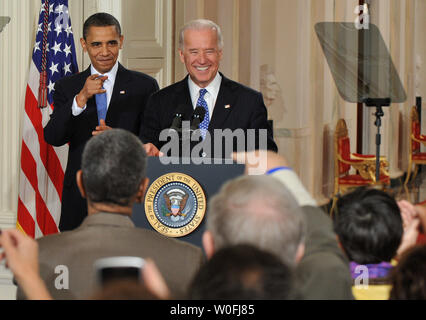 President Barack Obama (L) and Vice President Joe Biden are greeted by members of congress before Obama signed the the Health Insurance Reform Bill, in the East Room at the White House in Washington, March 23, 2010. UPI/Kevin Dietsch Stock Photo