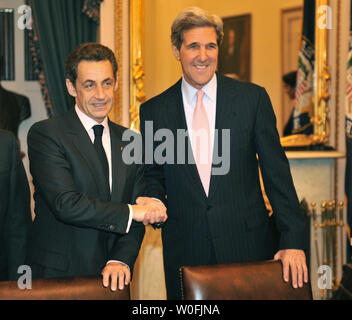 French President Nicolas Sarkozy (L) meets with Senate Foreign Relations Committee Chairman John Kerry (D-MA) on Capitol Hill in Washington on March 30, 2010.  UPI/Kevin Dietsch Stock Photo