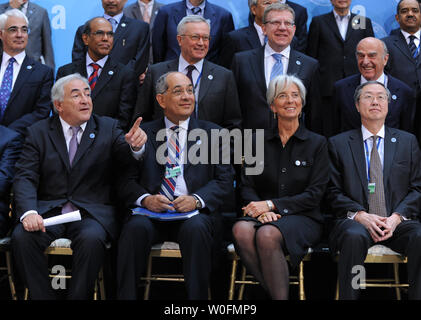 Members of International Monetary and Financial Committee (IMFC) gather for a group photo during the International Monetary Fund (IMF) and World Bank Spring Meetings in Washington on April 24, 2010. Seated (front row, L to R) are IMF Managing Director Dominique Strauss-Kahn, IMFC Chairman Youssef Boutros-Ghali, and French Finance Minister Christine Lagarde, and Chinese Finance Minister Zhou Xiaochuan.  In the second row (L to R) are British Finance Minister Alistair Darling, Reserve Bank of India chief Duvvuri Subbarao, Italian Finance Minister Giulio Tremonti, Russian Finance Minister Alexei Stock Photo