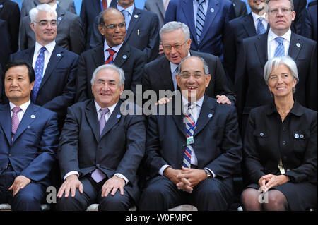 Members of International Monetary and Financial Committee (IMFC) gather for a group photo during the International Monetary Fund (IMF) and World Bank Spring Meetings in Washington on April 24, 2010. Seated (front row, L to R) are Jeung-Hyun Yoon, governor of the Bank of Korea, IMF Managing Director Dominique Strauss-Kahn, IMFC Chairman Youssef Boutros-Ghali, and French Finance Minister Christine Lagarde. In the second row (L to R) are British Finance Minister Alistair Darling, Reserve Bank of India chief Duvvuri Subbarao, Italian Finance Minister Giulio Tremonti, and Russian Finance Minister A Stock Photo