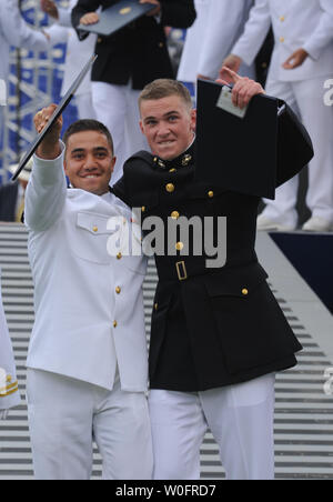 Graduates celebrate after receiving their diploma at the U.S. Naval Academy  Graduation and Commissioning ceremonies in Annapolis, Maryland on May 28,  2010. UPI/Alexis C. Glenn Stock Photo - Alamy