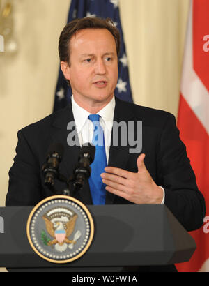 British Prime Minister David Cameron makes a point during a joint press conference with United States President Barack Obama in the East Room of the White House in Washington on July 20, 2010.  Cameron is making his first visit to the United States 10 weeks after taking office.     UPI/Pat Benic Stock Photo