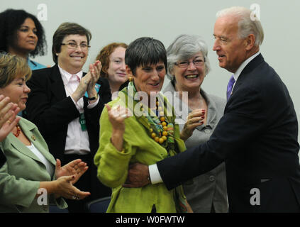 Vice President Joe Biden hugs Rep. Rosa Delauro (D-CT) at a Middle Class Task Force event on work place pay equality in the Eisenhower Executive Office Building in Washington on July 20, 2010.   UPI/Kevin Dietsch Stock Photo