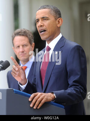 President Barack Obama, joined by Treasury Secretary Timothy Geithner, speaks on the economy before announcing Elizabeth Warren (not pictured) as the new head of the Consumer Financial Protection Bureau in the Rose Garden at the White House in Washington on September 17, 2010.  UPI/Kevin Dietsch Stock Photo