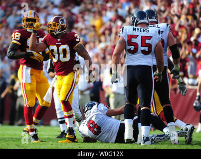 Oct. 10, 2010 - Landover, Maryland, United States of America - Washington  Redskins safety LaRon Landry (30) pass interception and run stopped by  Green Bay Packers wide receiver Donald Driver (80), week