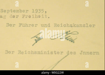 Adolf Hitler's signature is seen on the original Nuremberg Laws which are on display at the National Archives in Washington on October 6, 2010. The laws, established by Adolf Hitler and the Nazis, restricted the rights of German Jews. UPI/Kevin Dietsch Stock Photo