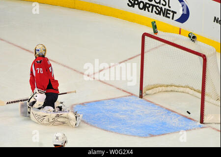 Washington Capitals' goalie Braden Holtby watches the puck go into the net from a shot by Philadelphia Flyers' Darroll Powe in the first period at the Verizon Center in Washington on November 7, 2010.  UPI/Kevin Dietsch Stock Photo