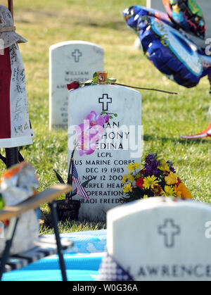 US Marine Corps Lance Corporal Brian Anthony Medina, killed in Iraq in 2004, is remembered with flowers and other items on Veterans Day at Arlington National Cemetery in Arlington, Virginia, on November 11, 2010.   UPI/Roger L. Wollenberg Stock Photo