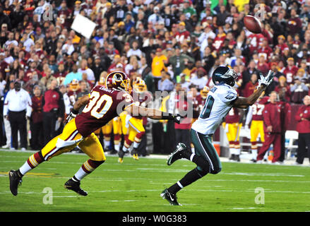 Oct. 10, 2010 - Landover, Maryland, United States of America - Washington  Redskins safety LaRon Landry (30) pass interception and run stopped by  Green Bay Packers wide receiver Donald Driver (80), week