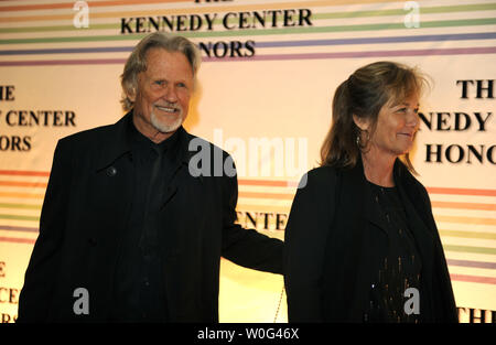Singer Kris Kristofferson and wife Lisa arrive for the 2010 Kennedy Center Honors and walk past photographers on the red carpet as they arrive for an evening of gala entertainment at the Kennedy Center, December 5, 2010, in Washington,D.C.  The Honors are bestowed annually on five artists for their lifetime achievement in the arts, culture and entertainment.            UPI/Mike Theiler Stock Photo