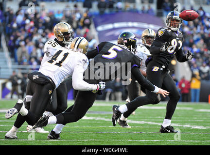 A stunned New Orleans Saints' Roman Harper walks off the field as the  Seattle Seahawks' celebrate their 41-36 win over the Super Bowl Defending  Champions in the NFC's wild-card playoff game on