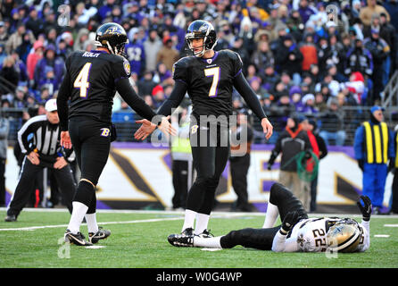 Baltimore Ravens' kicker Billy Cundiff celebrates with holder Sam Koch after kicking a 32-yard field goal to take the lead against the New Orleans Saints during the fourth quarter at M&T Banks Stadium in Baltimore on December 19, 2010. The   UPI/Kevin Dietsch Stock Photo