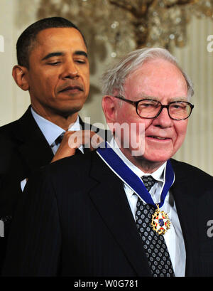 President Barack Obama awards the 2010 Presidential Medal of Freedom to Warren Buffet during a ceremony at the White House in Washington on February 15, 2011.  UPI/Kevin Dietsch Stock Photo