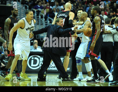 Washington Wizards' head coach Flip Saunders separates Washington Wizards' JaVale McGee (34) and Miami Heat's Juwan Howard during the first half at the Verizon Center in Washington on March 30, 2011.  UPI/Kevin Dietsch Stock Photo