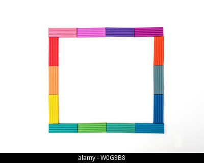 Colored plasticine on isolated white background.  Set of colorful plasticine.  Rainbow modeling clay piece for children play and creativity. Stock Photo