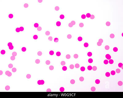Pink confetti on white background. Pink background. Holiday background. Stock Photo