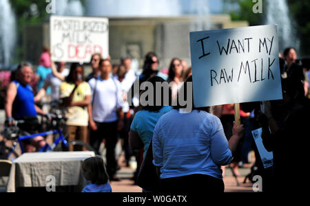 Raw milk supports attend a rally protesting the Food and Drug Administration's recent actions against traditional dairy farmers in Washington on May 16, 2011. Farmers and supporters rallied to show support for raw milk farmers.   UPI/Kevin Dietsch Stock Photo