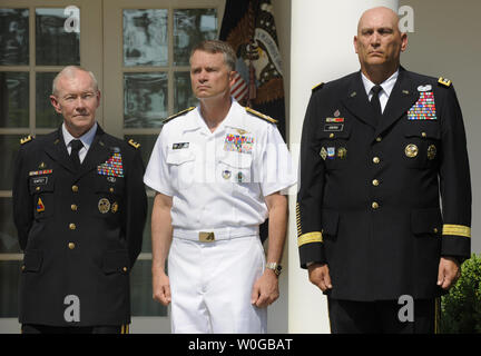 (L-R) US Army Gen. Martin E. Dempsey, nominated as the next chairman of the Joint Chiefs of Staff, Adm. James Alexander 'Sandy' Winnefeld, Jr., next vice chairman of JCS and Gen. Raymond Odierno, the next Army Chief of Staff, listen to remarks by President Barack Obama,  May 30, 2011 in the Rose Garden of the White House, in Washington, D.C. Dempsey, who will replace out-going Adm. Mike Mullen, will be the military's highest ranking officer and oversee the drawdowns in Iraq and Afghanistan, defense budget cuts and the future role of the armed forces.     UPI/Mike Theiler Stock Photo