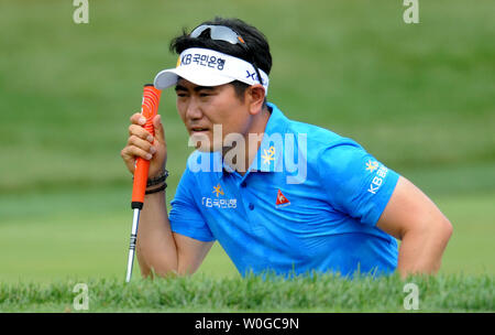 South Korea's Y.E. Yang lines up his putt on the first hole during the third round of the U.S. Open golf championship at Congressional Country Club in Bethesda, Maryland on June 18, 2011.  Yang started the day in second place.    UPI/Pat Benic Stock Photo