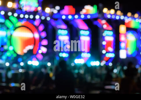 Abstract multi-colored light background with defocused bokeh light. The stage of the entertainment show. Stock Photo