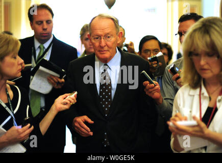 Sen. Lamar Alexander (R-TN) speaks to reports as he leaves after speaking after the weekly luncheons on Capitol Hill in Washington, D.C. on July 26, 2011.  UPI/Kevin Dietsch Stock Photo