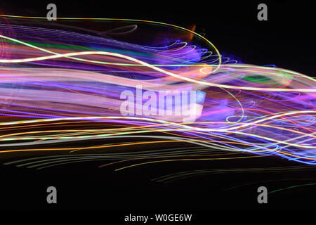Abstract background of night light on street. Multicolored striped lines in motion made from  lighting effect ,Light trails over black long exposure s Stock Photo