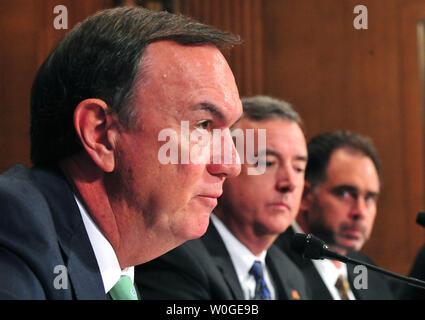 Wal-Mart CEO Michael Duke testifies alongside Thomas Clark, CEO of Kimberly-Clark and Gregory Lang, CEO of PMC-Sierra Inc., during a Senate Finance Committee hearing on the U.S. tax code and how it affects business practices, on Capitol Hill in Washington on July 27, 2011.  UPI/Kevin Dietsch Stock Photo