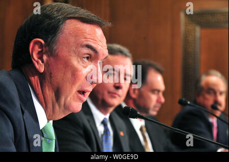 Wal-Mart CEO Michael Duke testifies alongside Thomas Clark, CEO of Kimberly-Clark, Gregory Lang, CEO of PMC-Sierra Inc., and Larry Merlo, CEO of CVS Caremark Corp., during a Senate Finance Committee hearing on the U.S. tax code and how it affects business practices, on Capitol Hill in Washington on July 27, 2011.  UPI/Kevin Dietsch Stock Photo