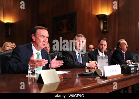 From left to right, Wal-Mart CEO Michael Duke, Thomas Clark, CEO of Kimberly-Clark, Gregory Lang, CEO of PMC-Sierra Inc., and Larry Merlo, CEO of CVS Caremark Corp., testifies during a Senate Finance Committee hearing on the U.S. tax code and how it affects business practices, on Capitol Hill in Washington on July 27, 2011.  UPI/Kevin Dietsch Stock Photo