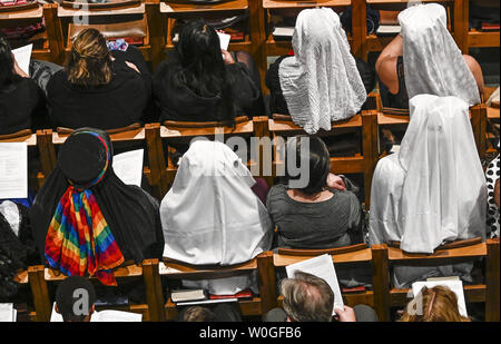 Attendees of the Matthew Shepard remembrance service listen to a choral prelude at the Washington National Cathedral on October 26, 2018 in Washington, DC. Shepard was murdered in Wyoming twenty years ago and is to be interred at the National Cathedral. Photo by Leigh Vogel/UPI Stock Photo