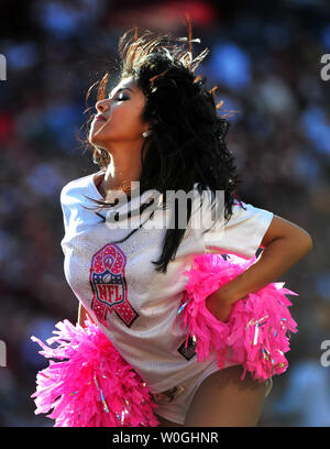 An Eagles cheerleader performs on the field, on September 16th