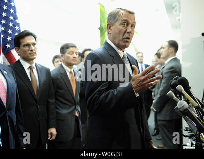 House Speaker John Boehner, R-Ohio, speaks to the media, mostly about job creation, after a House Republican Conference meeting on Capitol Hill in Washington, DC, on October 25, 2011. With him are House Majority Leader Eric Cantor, R-Va., (L) and Rep. Jeb Hensarling, R-Texas.     UPI/Roger L. Wollenberg Stock Photo