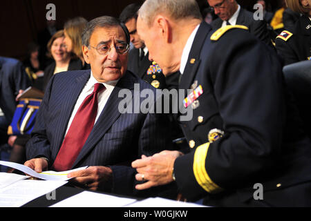 Defense Secretary Leon Panetta talks to chairman of the Joint Chiefs of Staff Army Gen. Martin Dempsey prior to a Senate Armed Services Committee hearing on security issues relating to Iraq in Washington on November 15, 2011.  UPI/Kevin Dietsch Stock Photo
