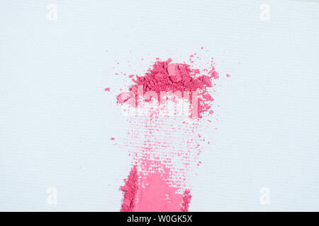 Eye shadow or bronzer pink smudge on white background. Stock Photo