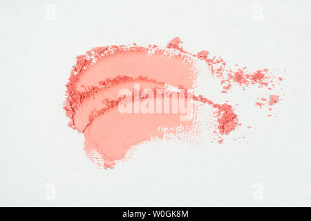 Eye shadow or bronzer pink smudge on white background. Stock Photo