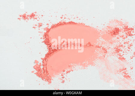 Eye shadow or bronzer pink smudge on white background. Stock Photo