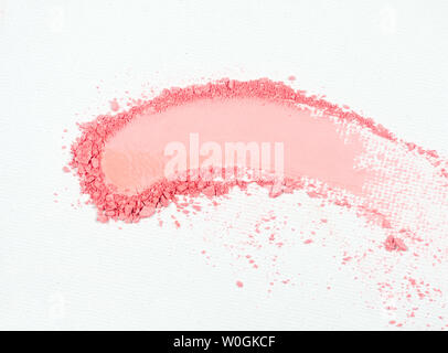 Eye shadow or bronzer pink smudge on white background. Stock Photo